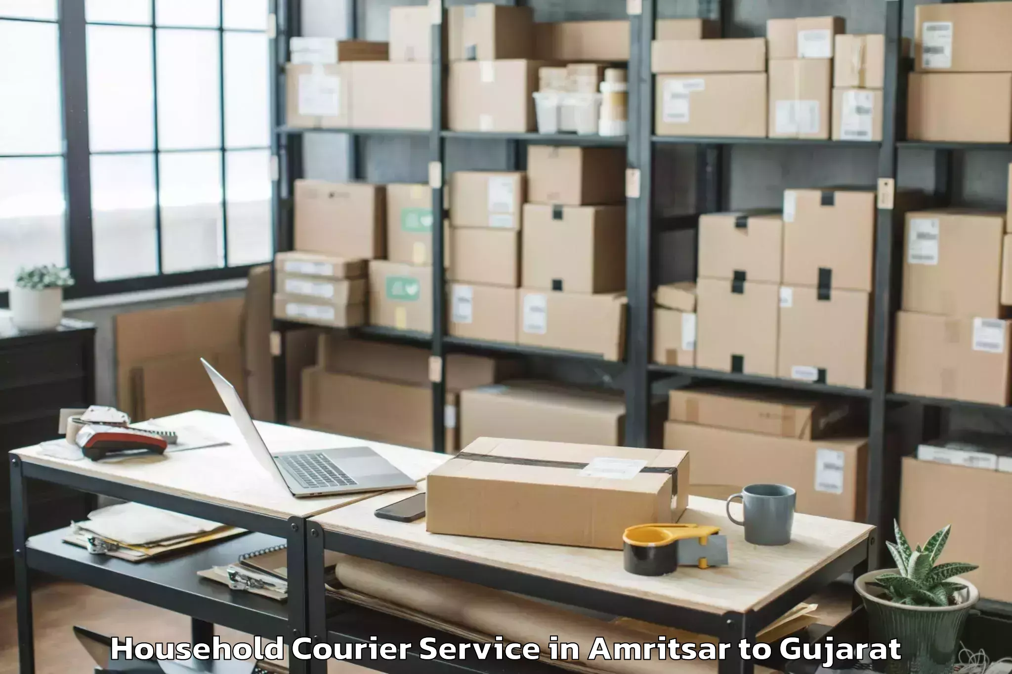 Book Amritsar to Crystal Mall Rajkot Household Courier Online